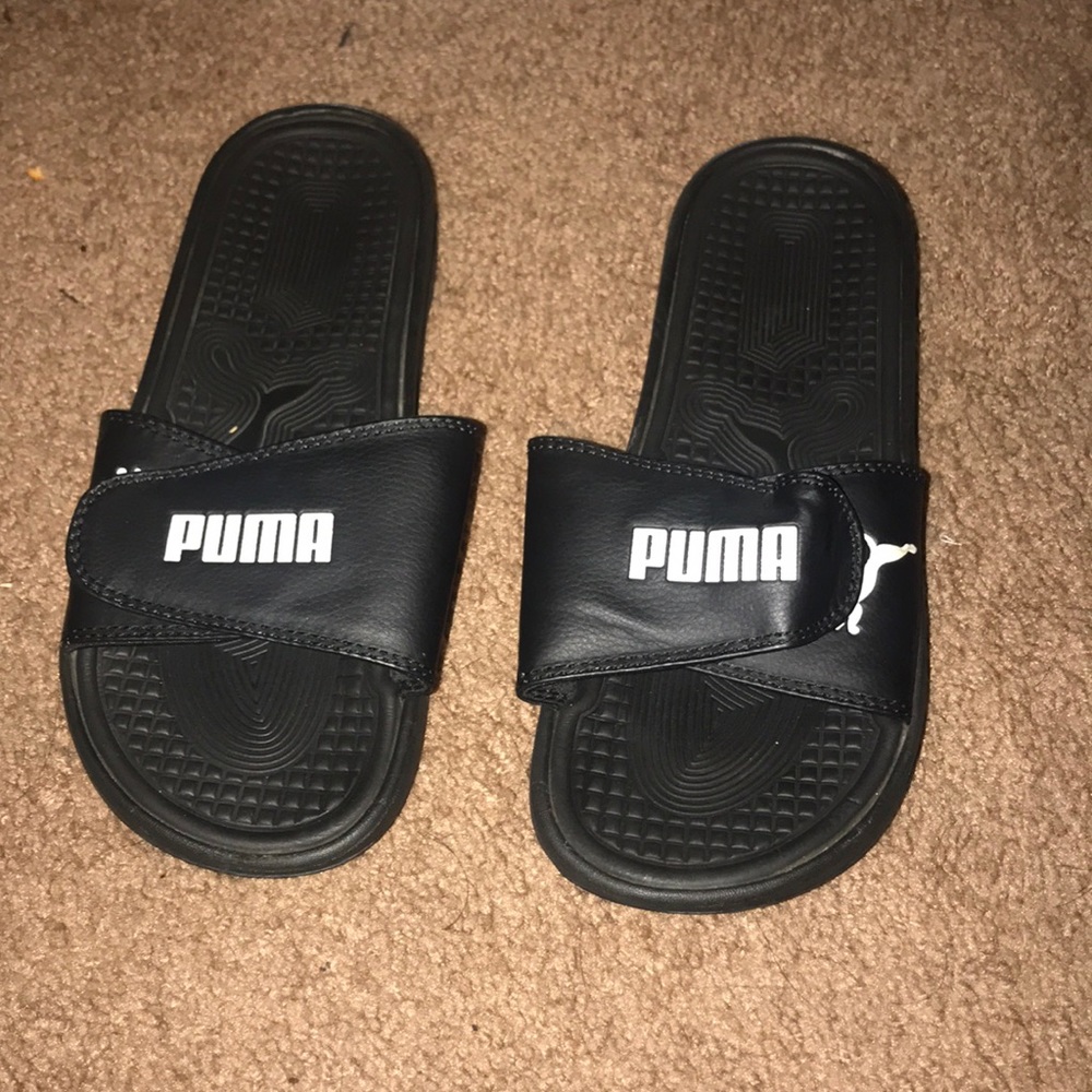 Black puma slip ons